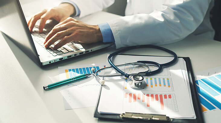 Doctor working on a laptop