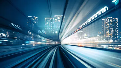 Motion blur of train moving to City