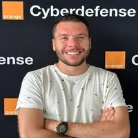 Tano Ianneta, Ethical Hacker, in the Orange Cyberdefense Switzerland Background