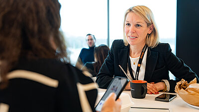 A woman attending a meeting