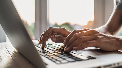 Hands using a computer keyboard