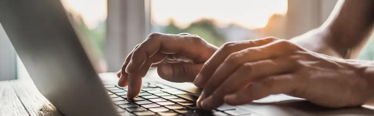 Hands using a computer keyboard