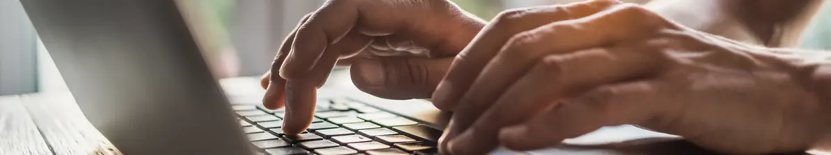 Hands using a computer keyboard