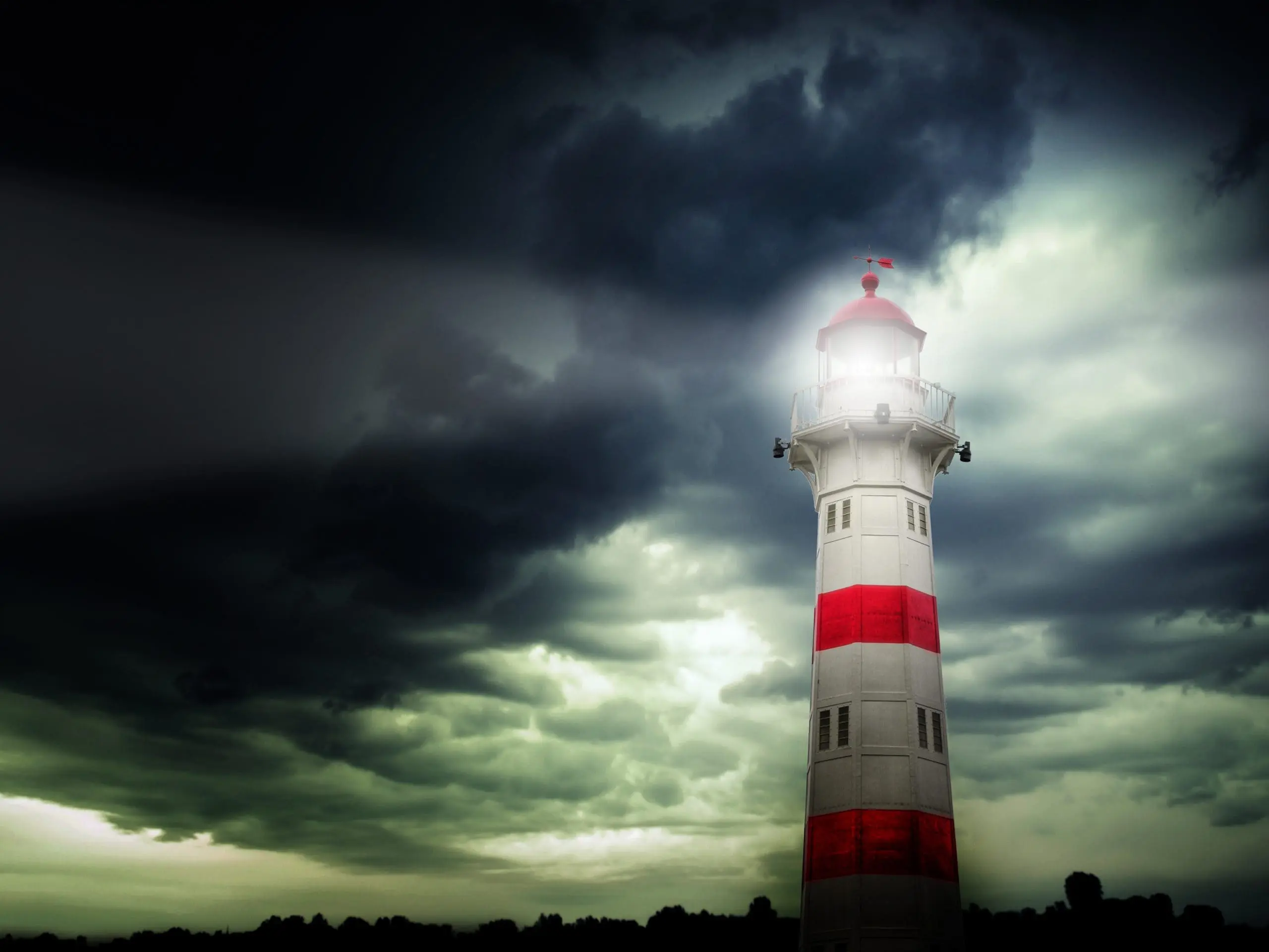 A lighthouse standing against a dark, stormy sky, symbolizing guidance and safety amid chaos.
