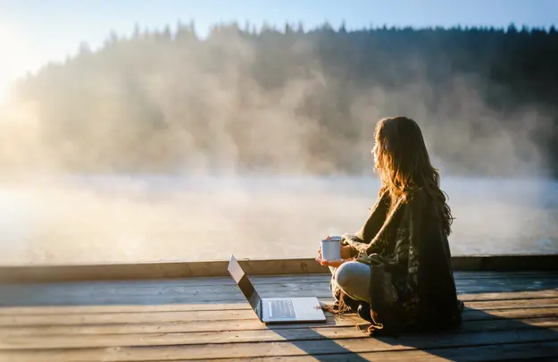 Remote worker connecting from a lakeside