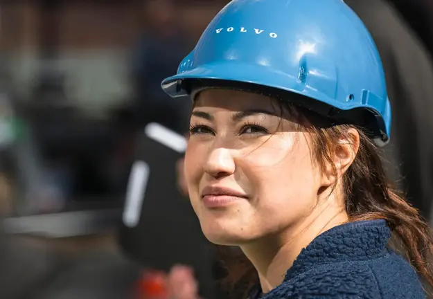 Woman in safety equipment at a work site