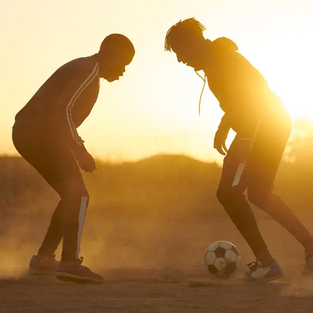Two men playing football