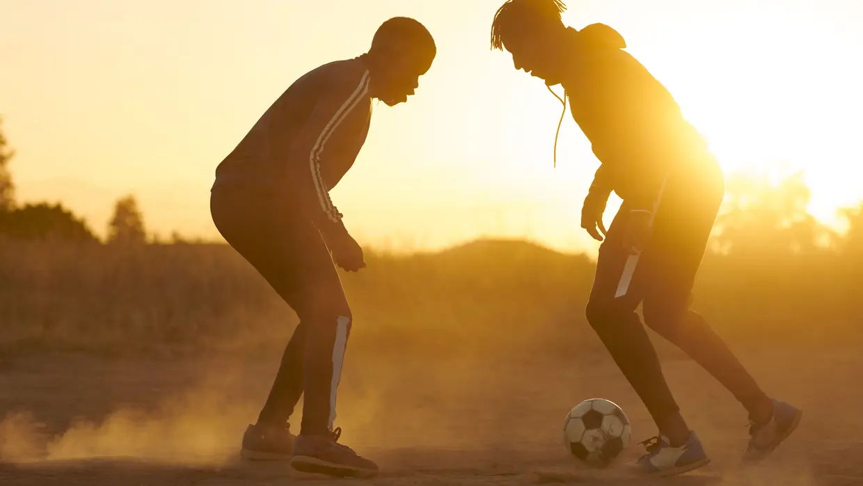 Two men playing football