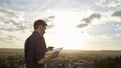 Man with a tablet outdoor
