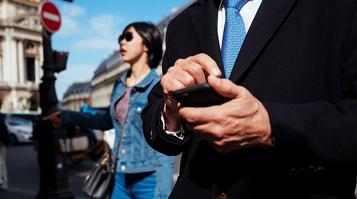 business man holding smartphone