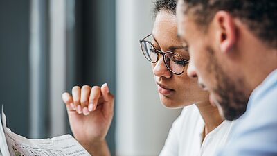 Two persons talking about business