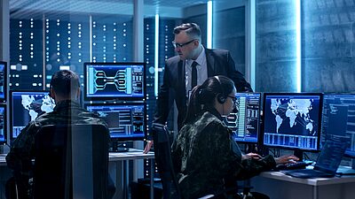A cybersecurity operations center where a team of professionals is monitoring and managing digital security threats.