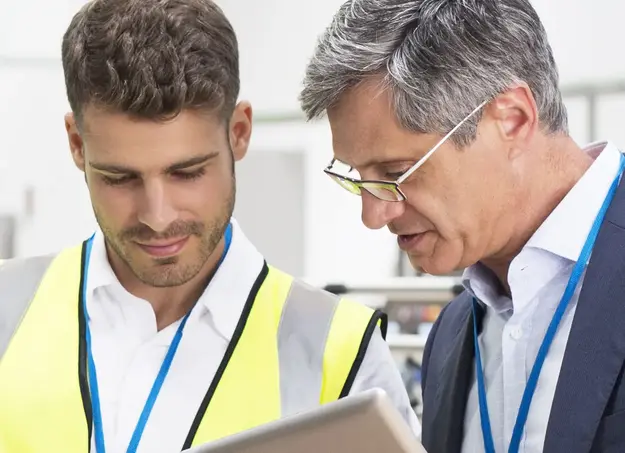 Two workers focused on project details