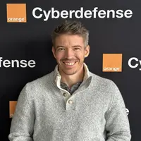 Alain Mowat in Orange Cyberdefense Switzerland background