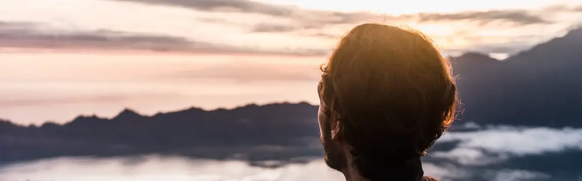 Man standing at sunset