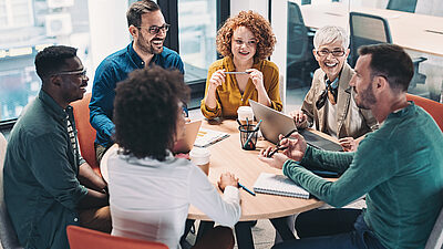 Casual business discussion at round table