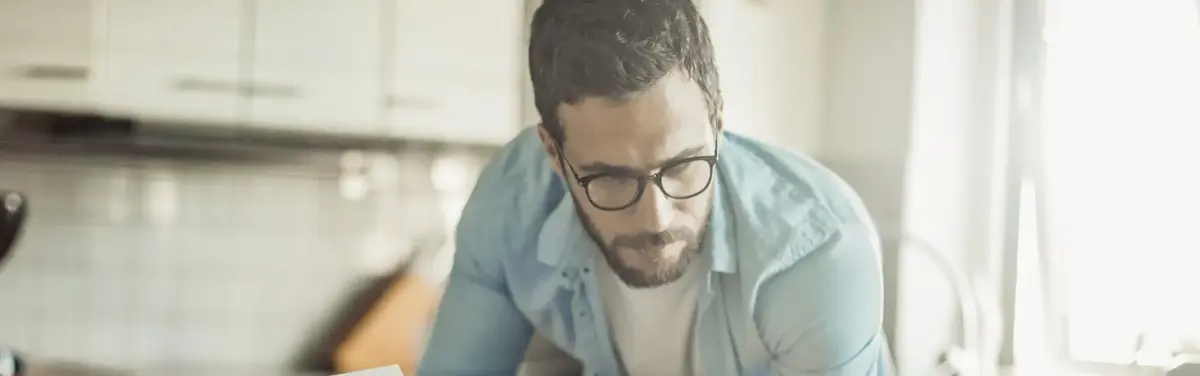 Man in kitchen laptop
