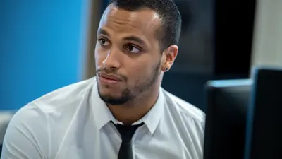 Business man inform of a computer screen