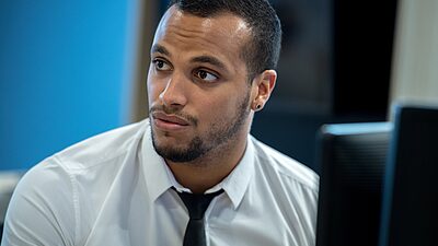 Business man inform of a computer screen