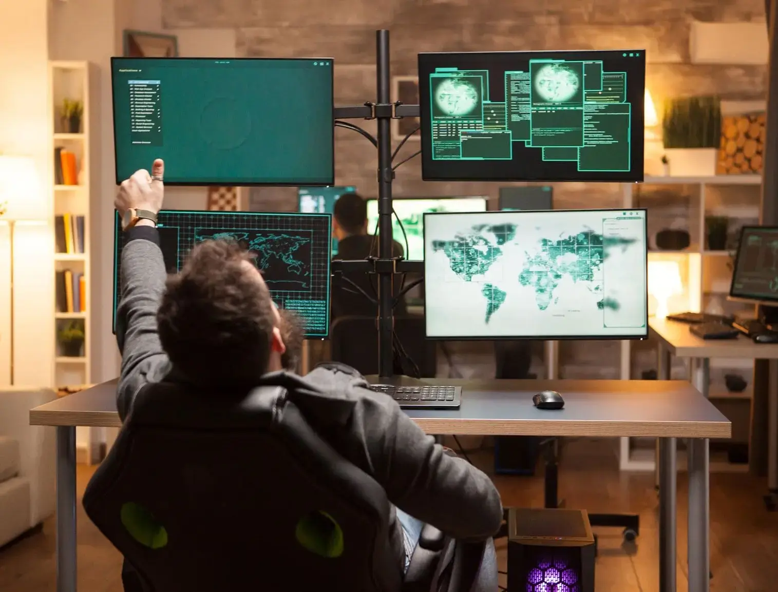 A person working in a high-tech control room or cybersecurity operations center, surrounded by multiple monitors displaying global maps, data, and security information.