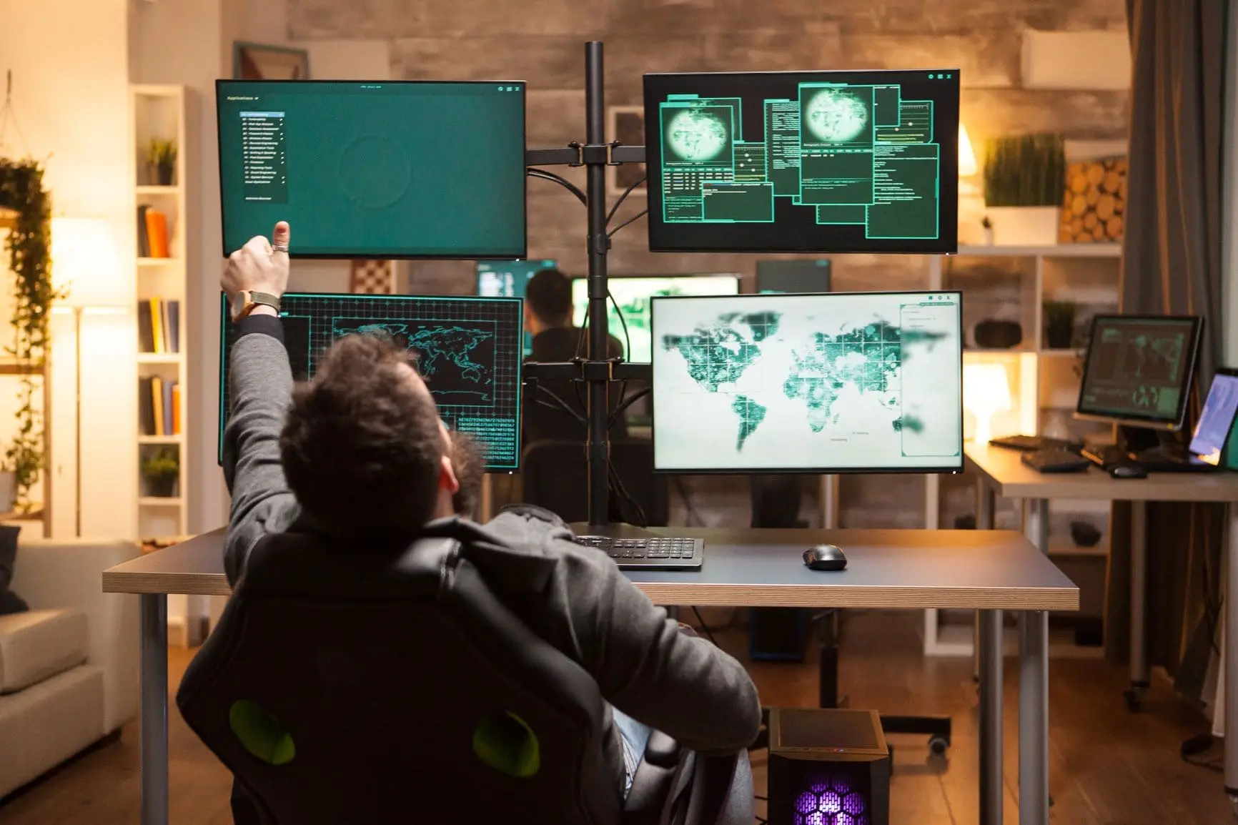 A person working in a high-tech control room or cybersecurity operations center, surrounded by multiple monitors displaying global maps, data, and security information.