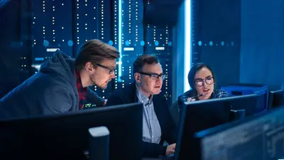 3 men looking at a screen