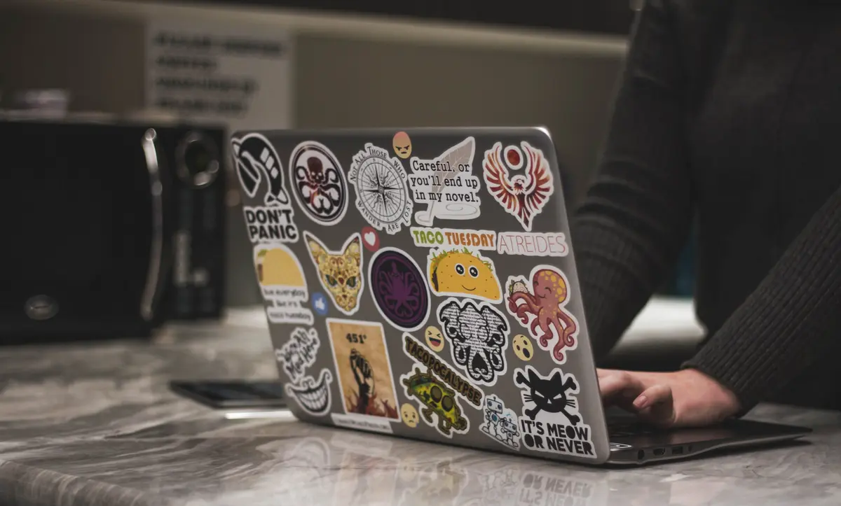 Laptop with lot of stickers on