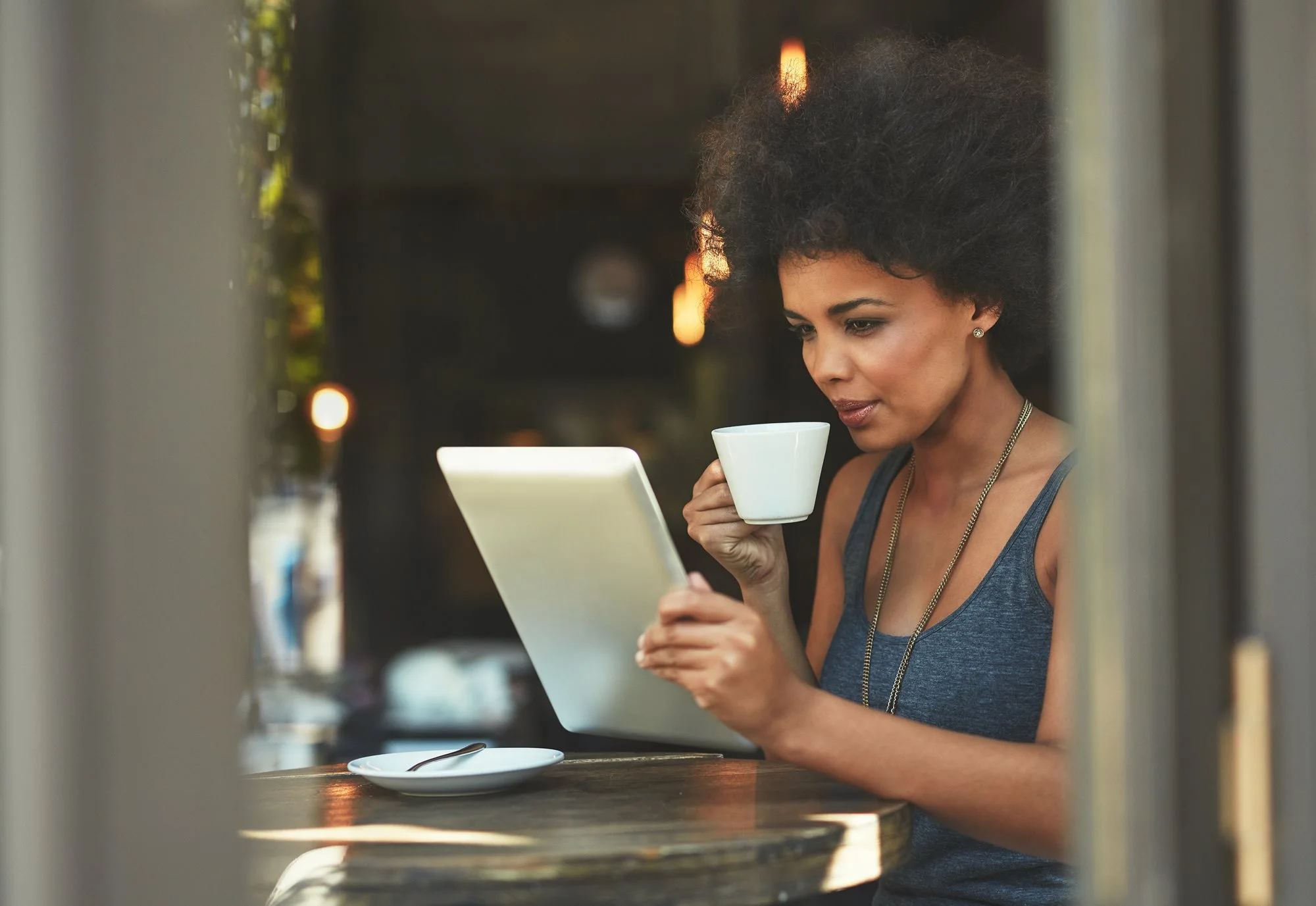 woman having coffee and working