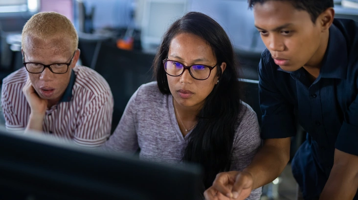 three people managing cloud security