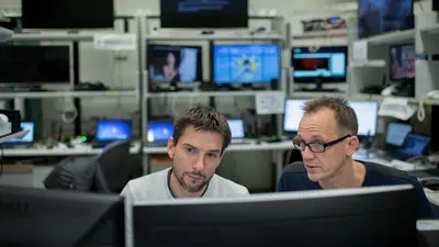Two experts in cybersecurity working together