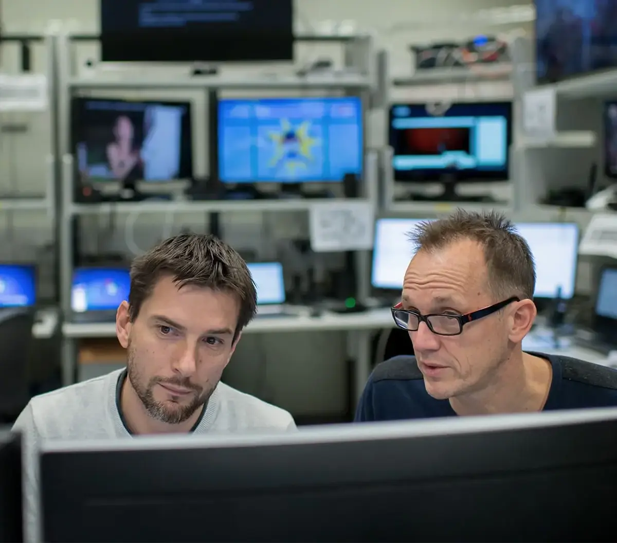 Two experts in cybersecurity working together