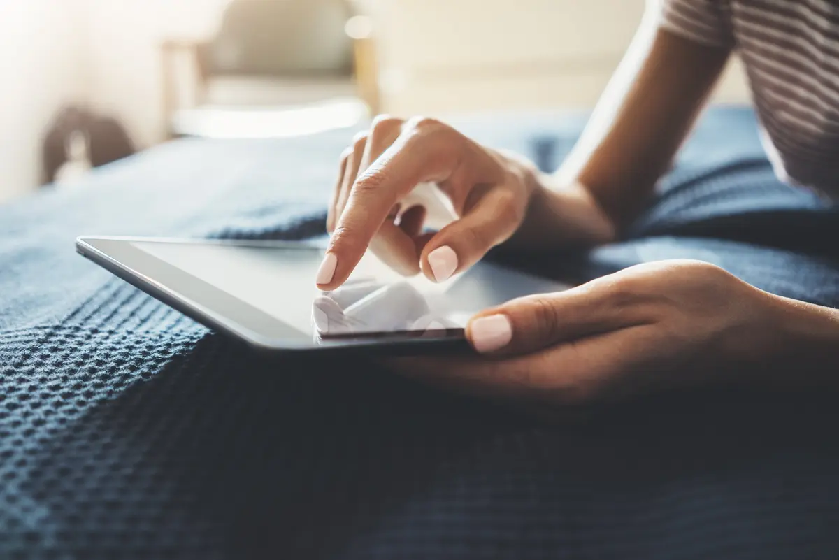 woman holding mobile device