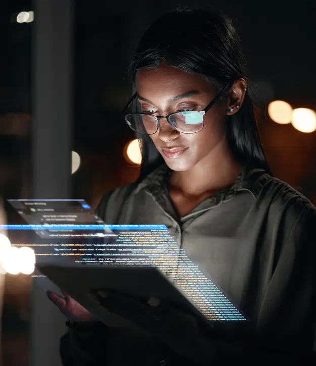 Security analyst reviewing vulnerability data on a tablet – Managed Vulnerability Intelligence